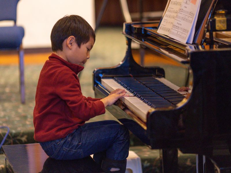 Aaron performing piano at Da Capo Academy of Music