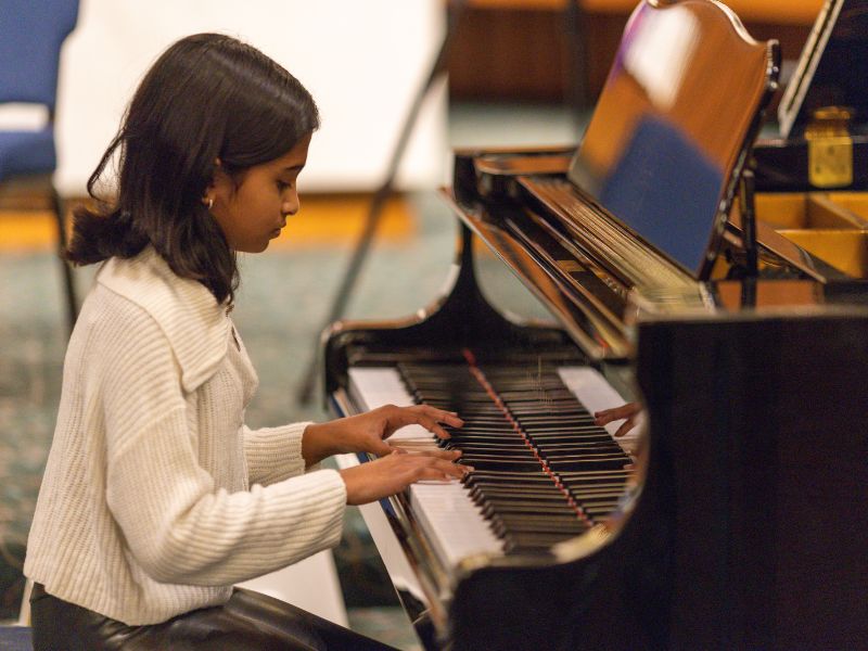 Alexi performing piano at Da Capo Academy of Music