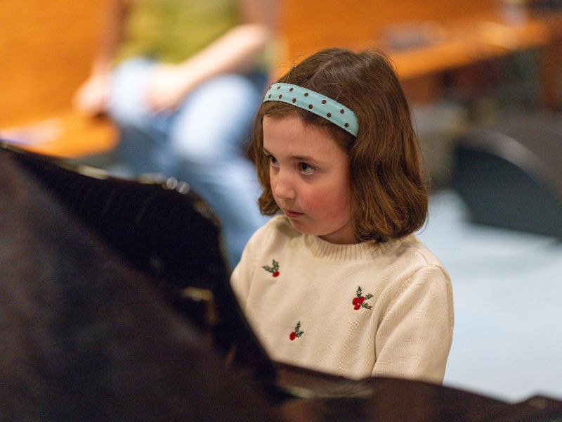 Evelyn performing piano at Da Capo Academy of Music