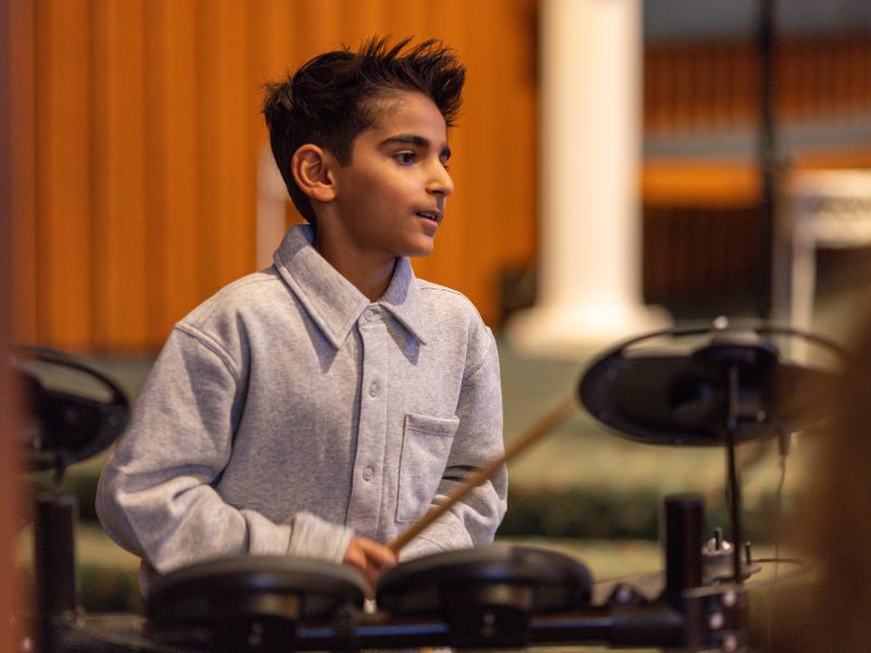 Rowan performing drums at Da Capo Academy of Music